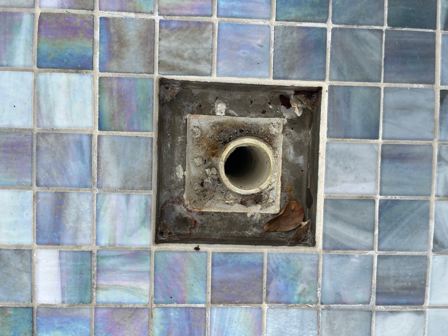 Existing square return opening in the customer's tiled pool surround